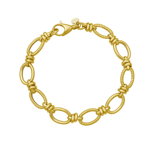 Handcrafted 14K Yellow Gold bracelet with double rings and twisted links, sparkling in the sunlight. Made in Italy, featuring a secure lobster clasp.