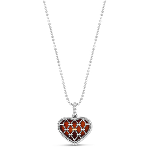 A sterling silver necklace with a netted heart-shaped pendant accented with red carnelian and real 18K gold, displayed on a white background.